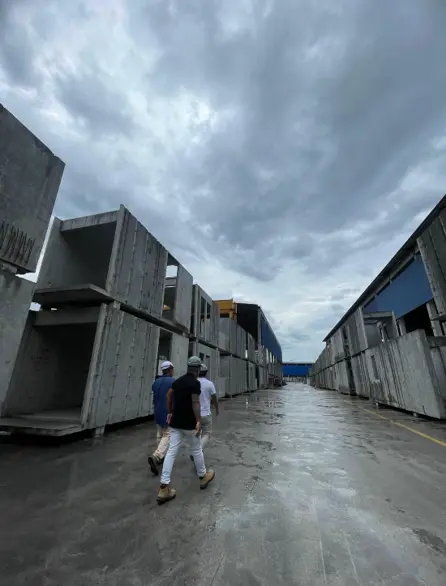 Rows of completed concrete PPVC modules stored in a production yard