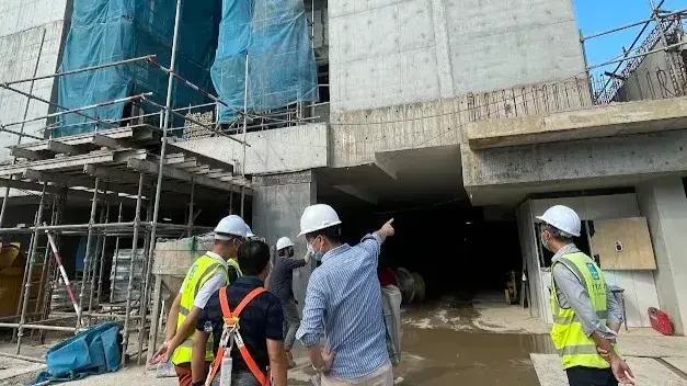 Project team reviewing construction interfaces together on site