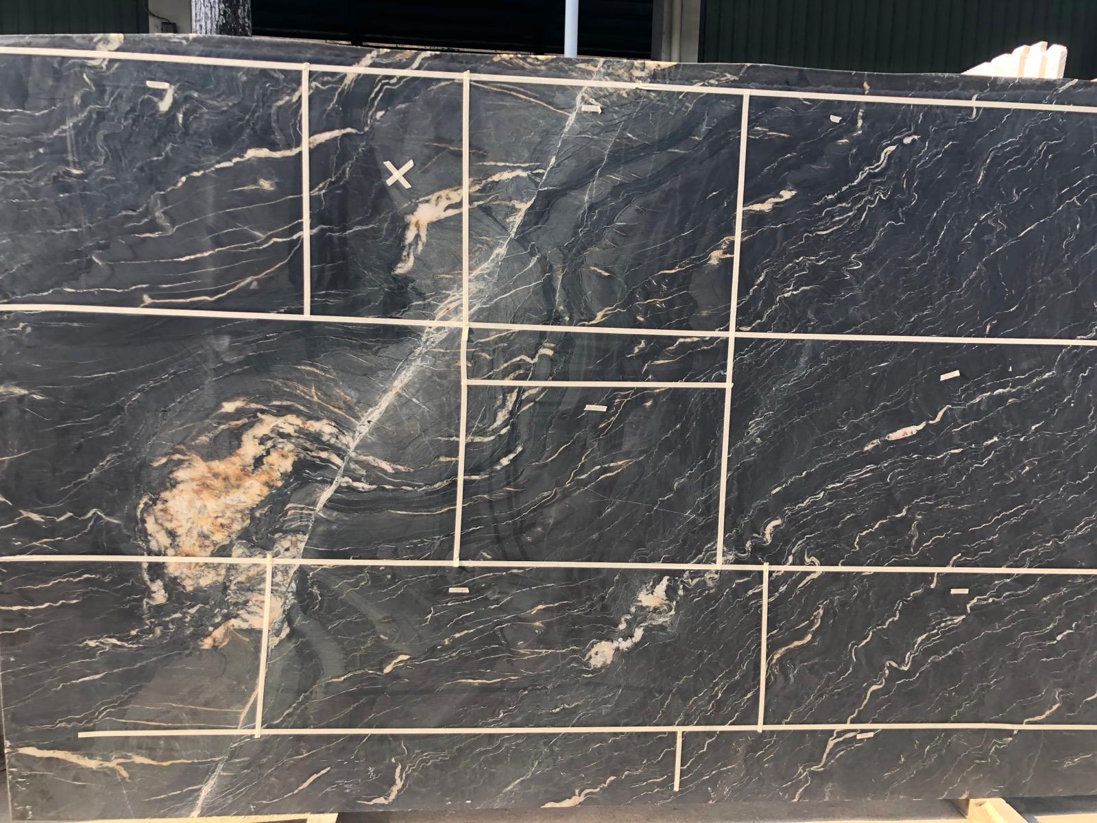 Belvedere natural stone slabs marked and taped for cutting layout