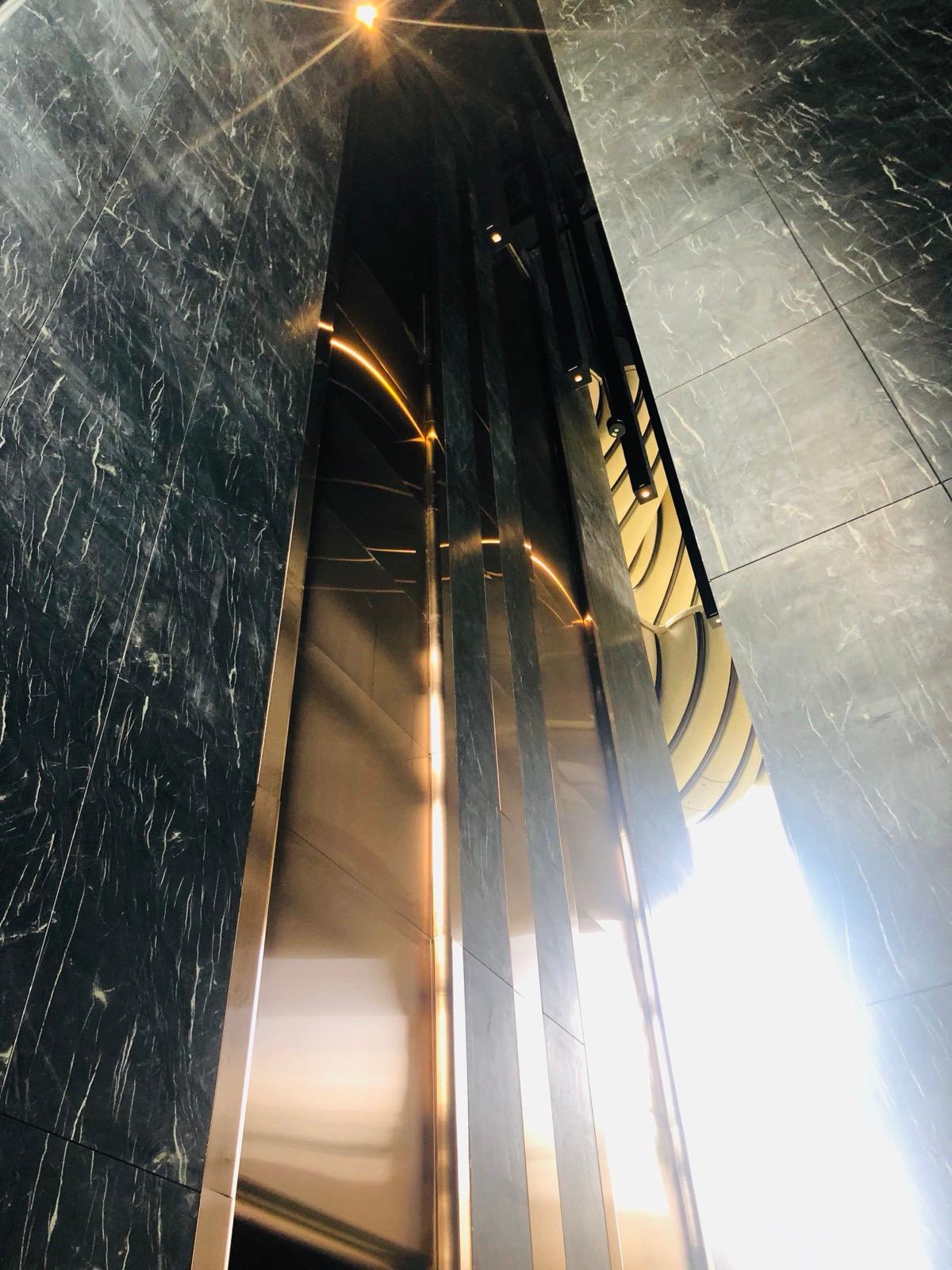 Full-height Belvedere stone cladding installed in a lobby