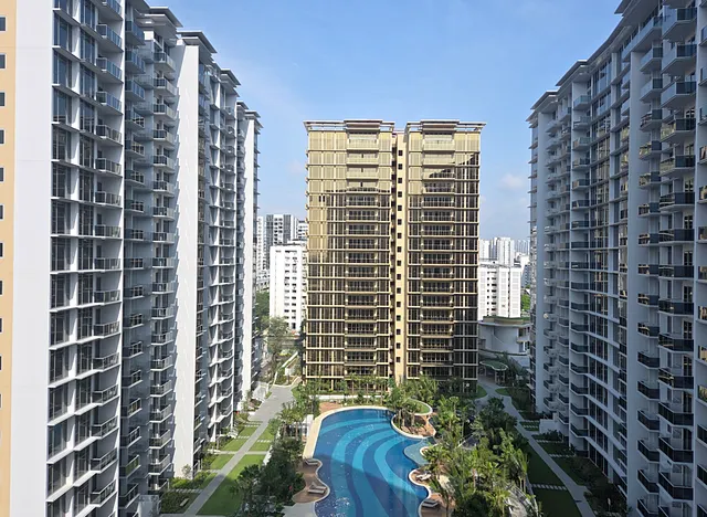 Completed residential towers and landscaped swimming pool after the final construction works